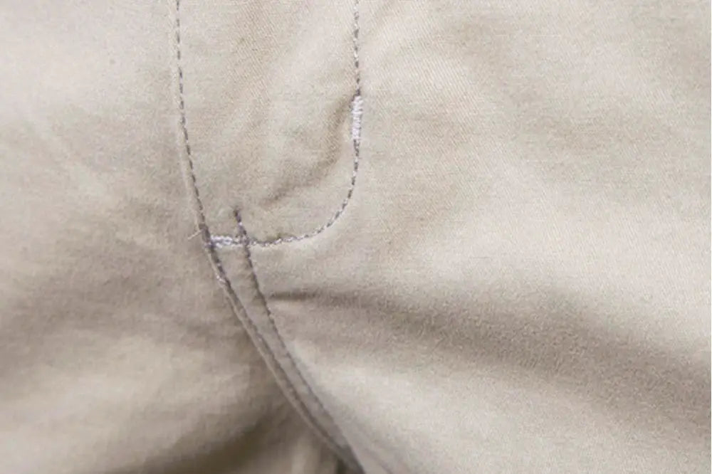 Men's beige 100% cotton shorts with elastic waist.