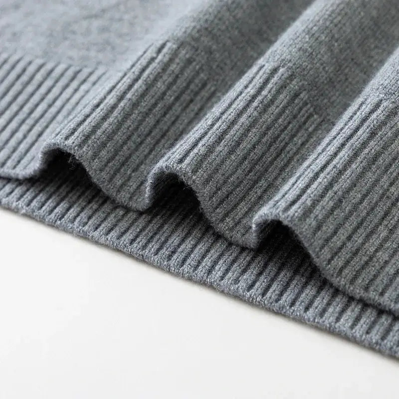 Men's gray ribbed knit crewneck pullover sweater with soft lightweight fabric.
