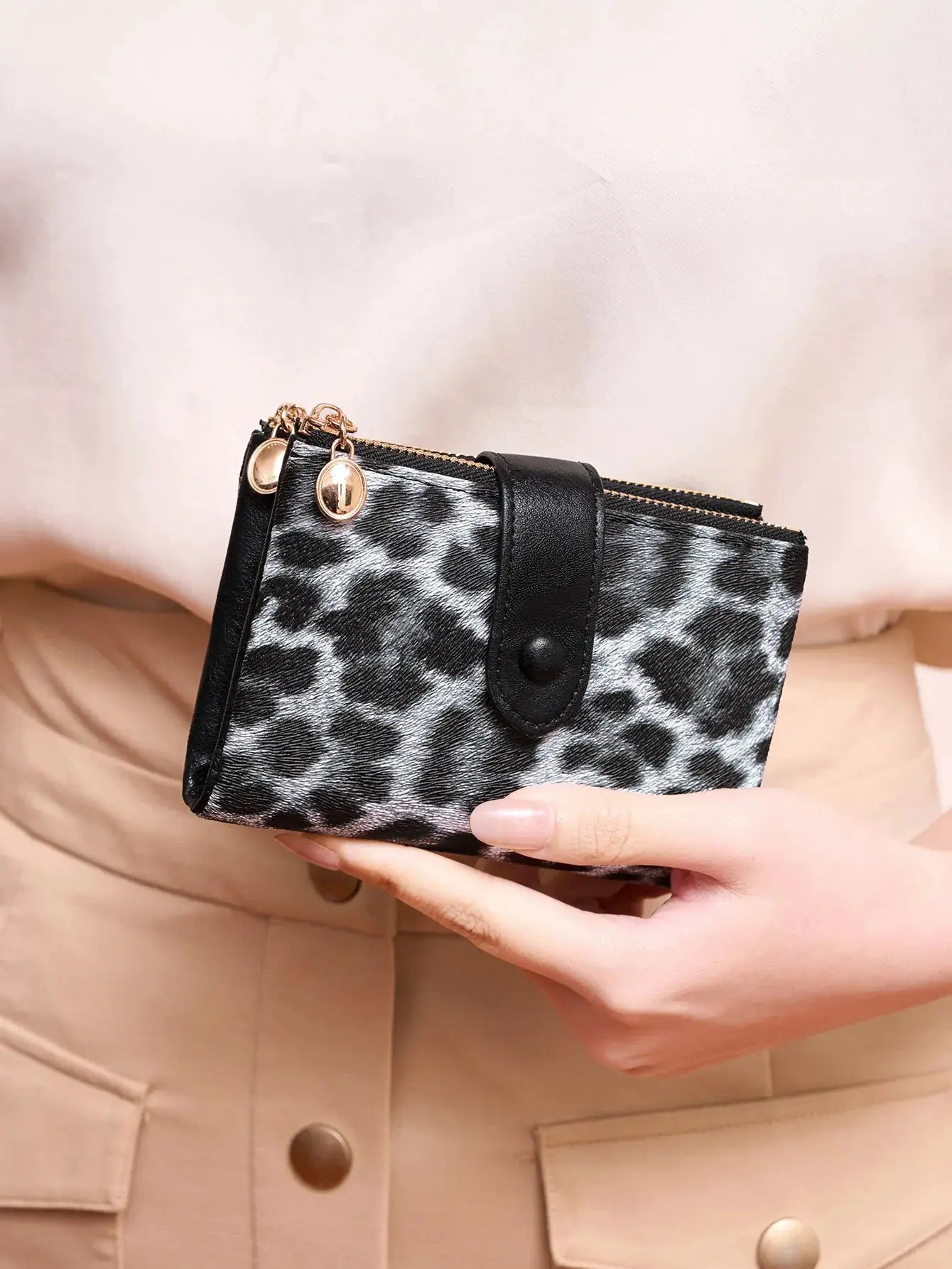 Minimalist women's wallet in leopard-print faux leather with gold-tone hardware; three-layer, double-zip card holder