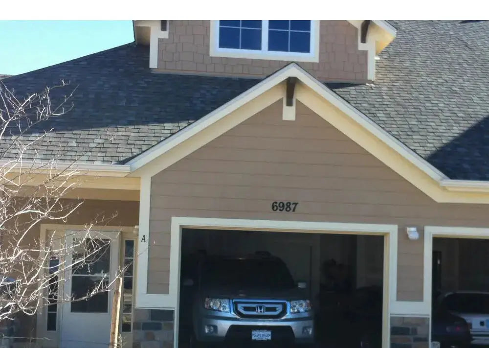 Smart garage door opener by Simples Market; DC5V, app-controlled, in a home garage with SUV