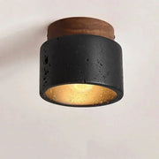 Simples Market Wabi-sabi ceiling lamp, black textured cylinder with wooden base and warm gold interior