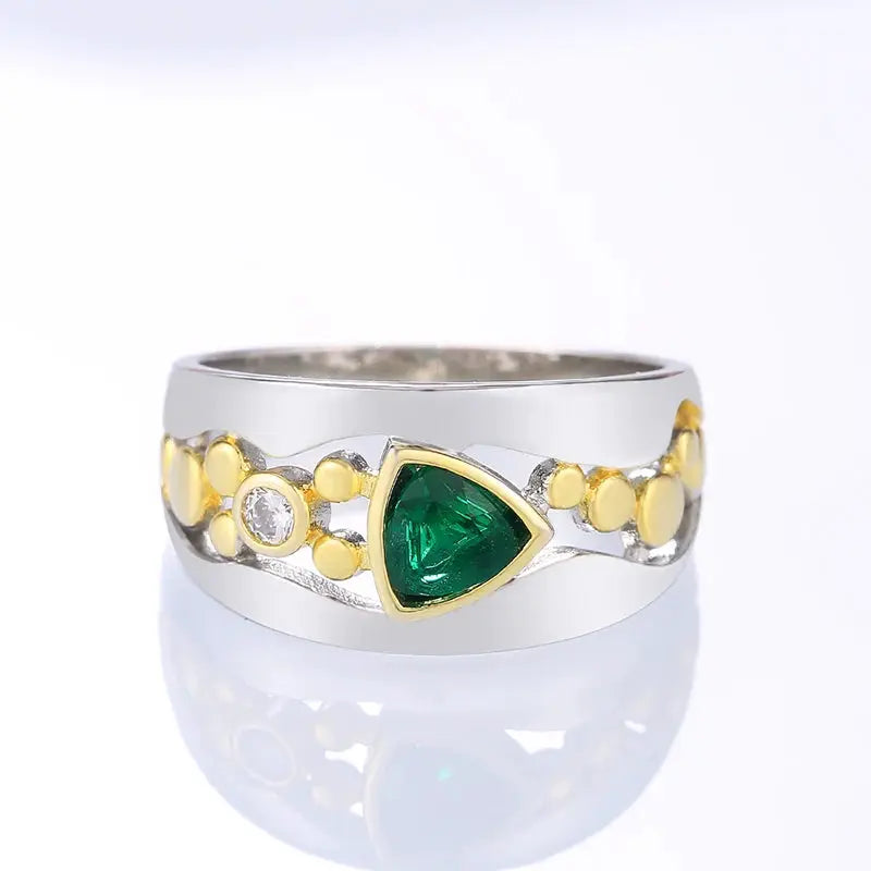 Ring, two-tone silver and gold band with triangular green CZ centerpiece for women