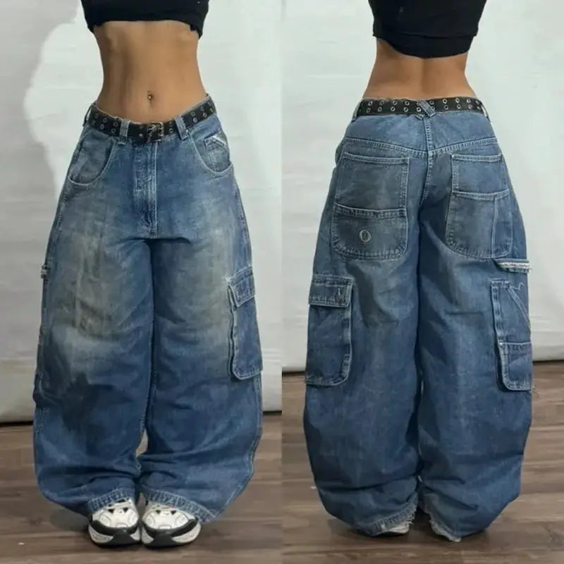 Men's oversized denim cargo jeans, blue-washed wide-leg with multiple pockets and a studded belt.