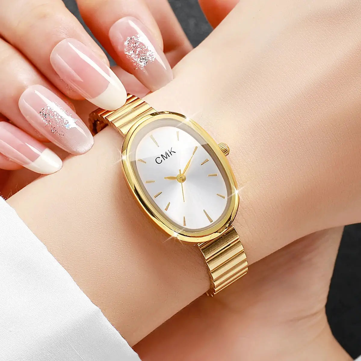 Gold oval-dial women's wristwatch with slim metal bracelet, CMK analog quartz