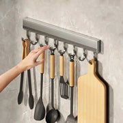Kitchen utensil rack Simples Market aluminum alloy 8-hook wall-mounted with wooden-handled utensils and a cutting board