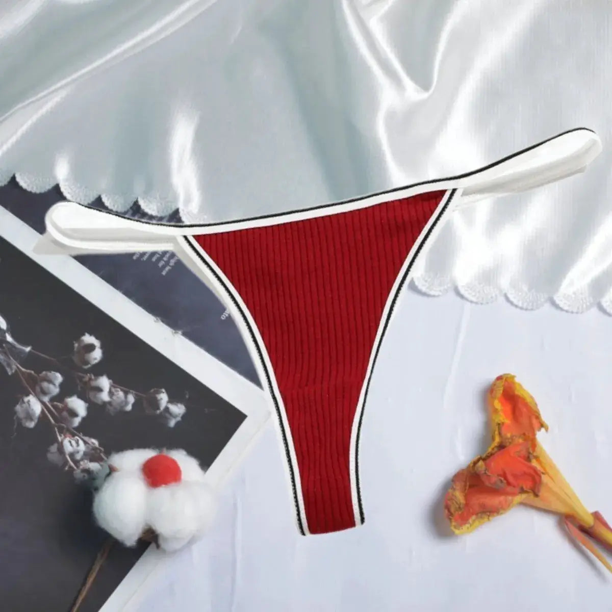 Women's red ribbed cotton thong with white trim and low-waist cut