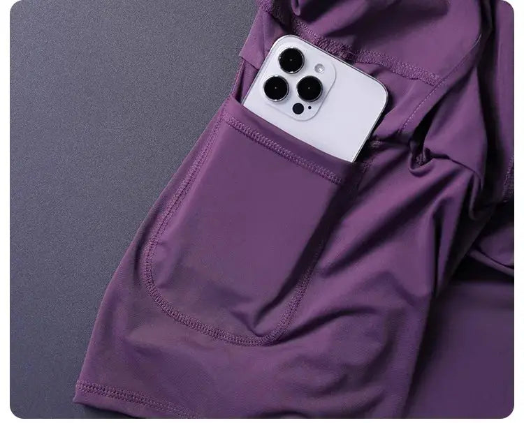 Women's purple 2-in-1 shorts with pockets; lightweight breathable athletic wear
