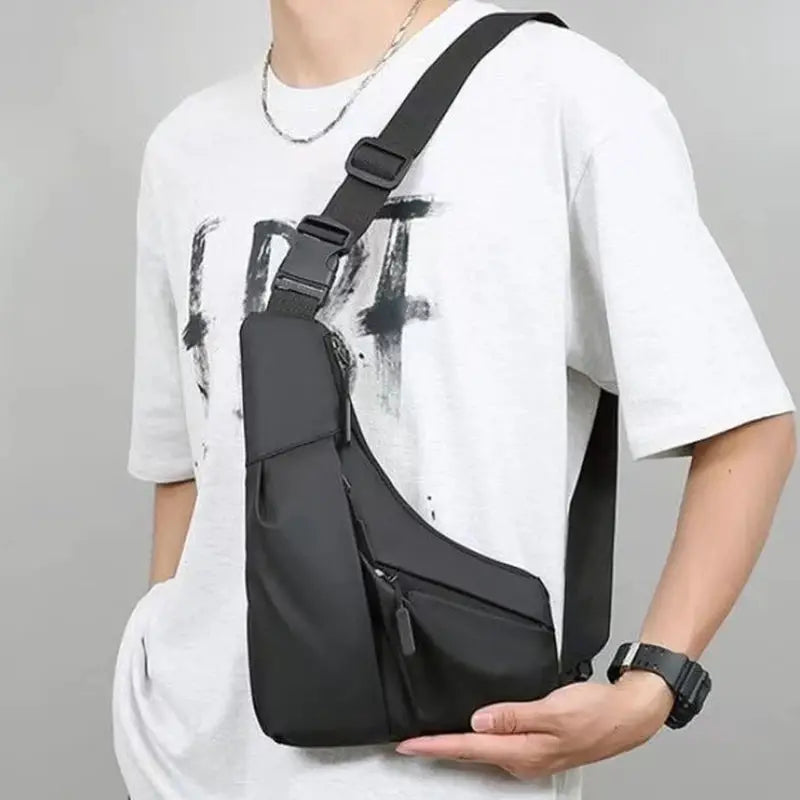 Men’s black crossbody chest bag with adjustable strap and multiple zip pockets for daily commuting.