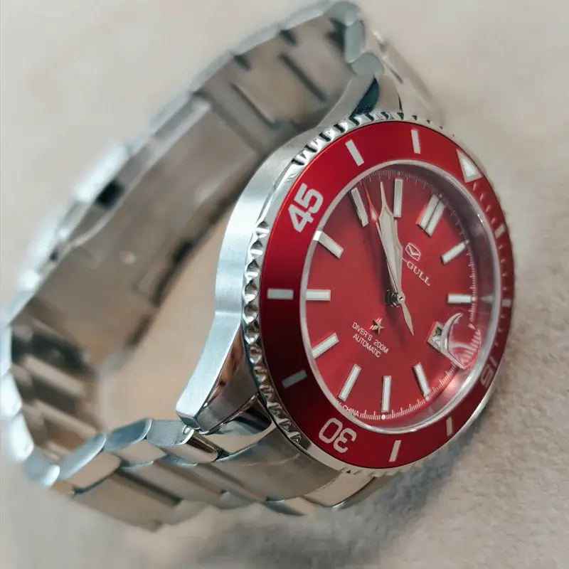 Seagull men's diving watch with red dial and red bezel on a stainless steel bracelet.