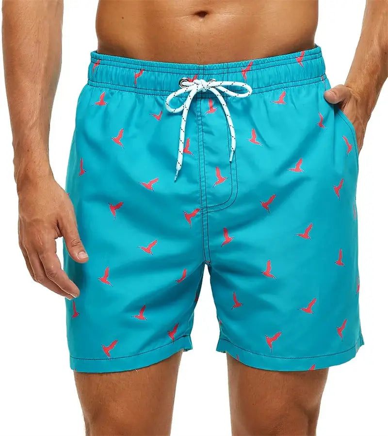 Turquoise men's swim trunks with white drawstring, red bird-pattern print, and side pockets