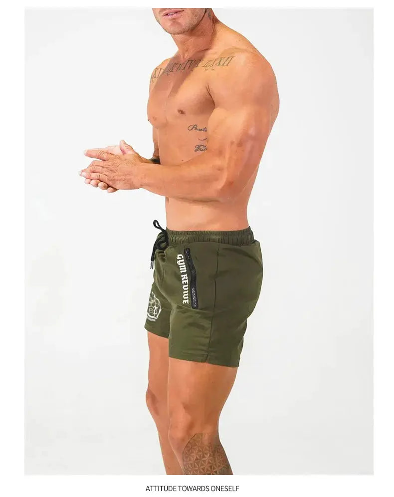 Men's Simples Market olive-green gym shorts with side zip pockets and drawstring, quick-dry fabric