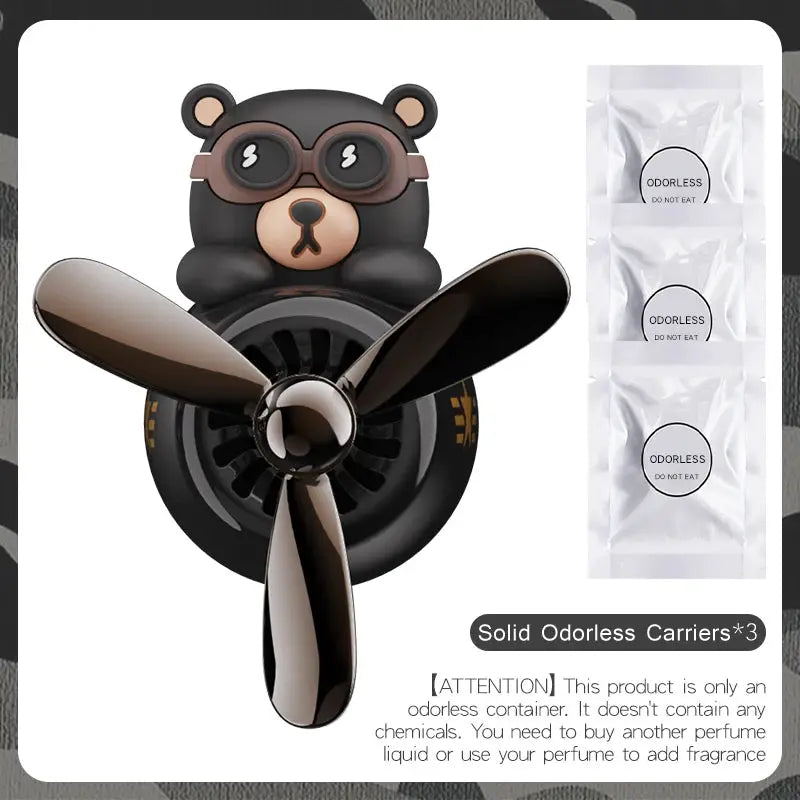Car air freshener ornament featuring a black bear pilot with propeller; includes 3 odorless carriers.