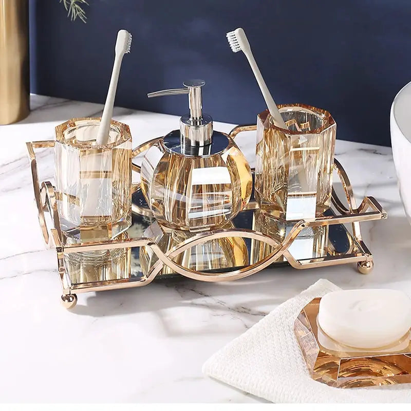 5-piece glass bathroom set on rose-gold tray with clear crystal lotion bottle, shampoo bottle, soap dispenser and toothbrush holders