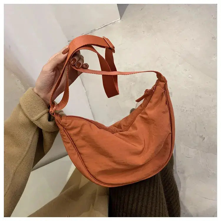 Casual orange nylon hobo crossbody bag with adjustable strap