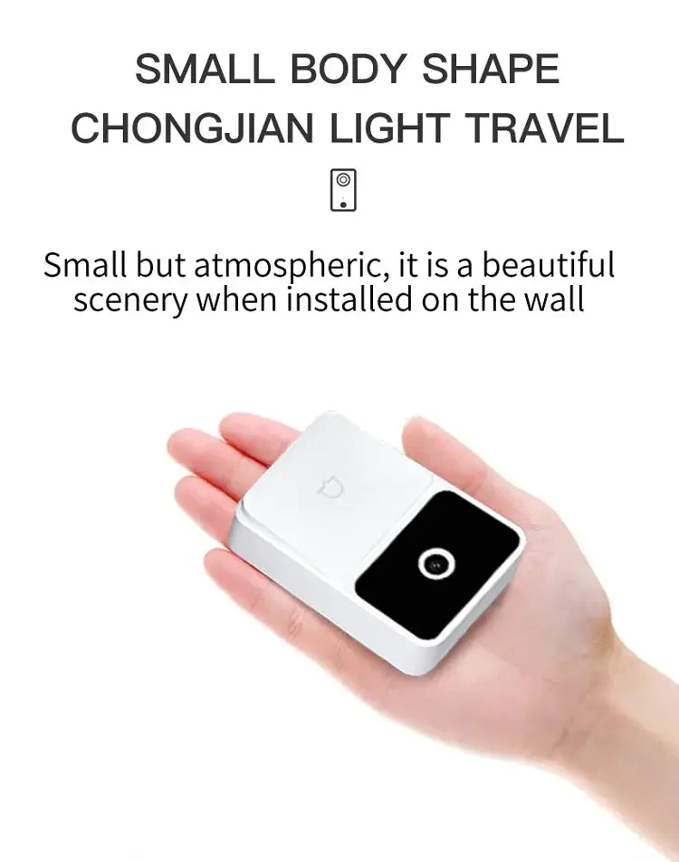 Wireless video doorbell in white with a black camera panel, compact handheld device.