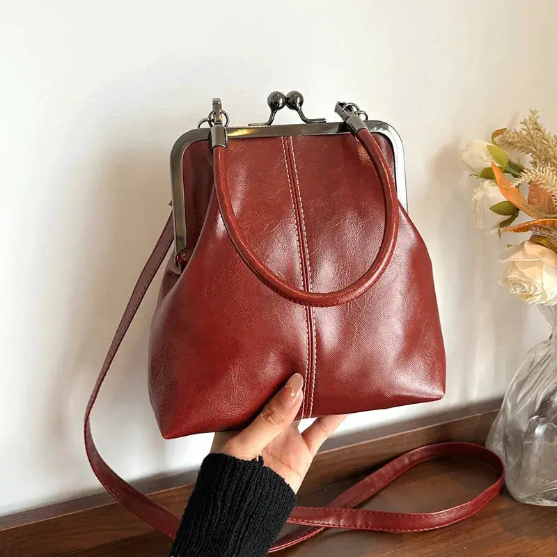 Vintage style women's handbag brown PU leather with metal frame clasp and shoulder strap