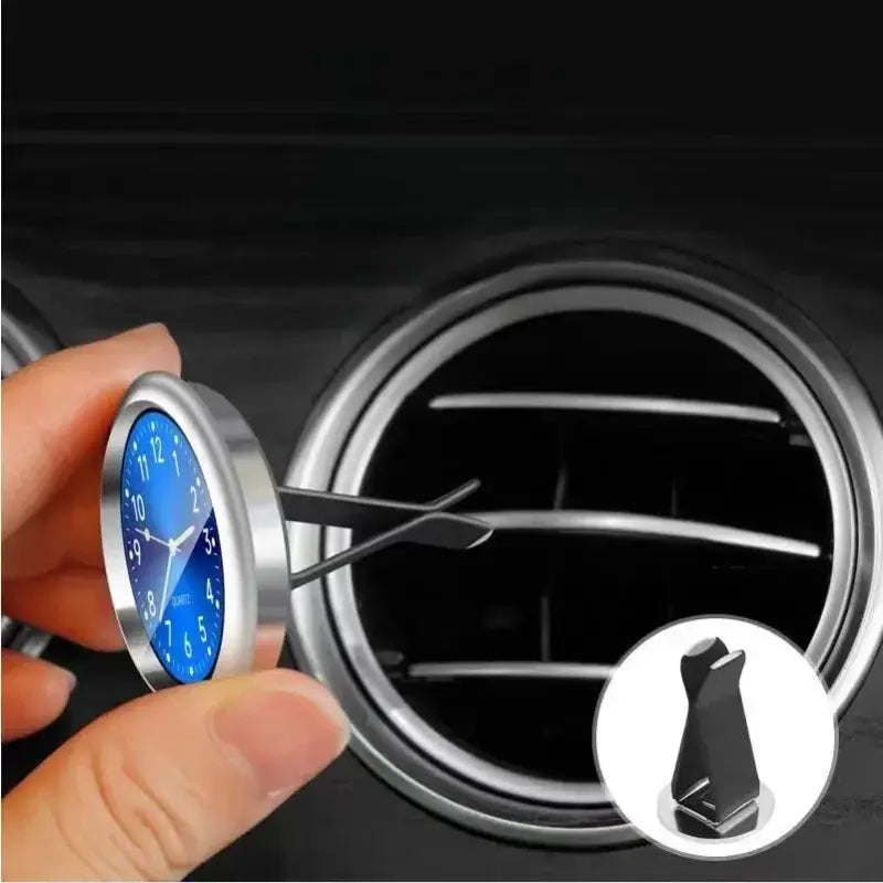 Car clock ornament with blue dial and silver metal case, stick-on vent mount