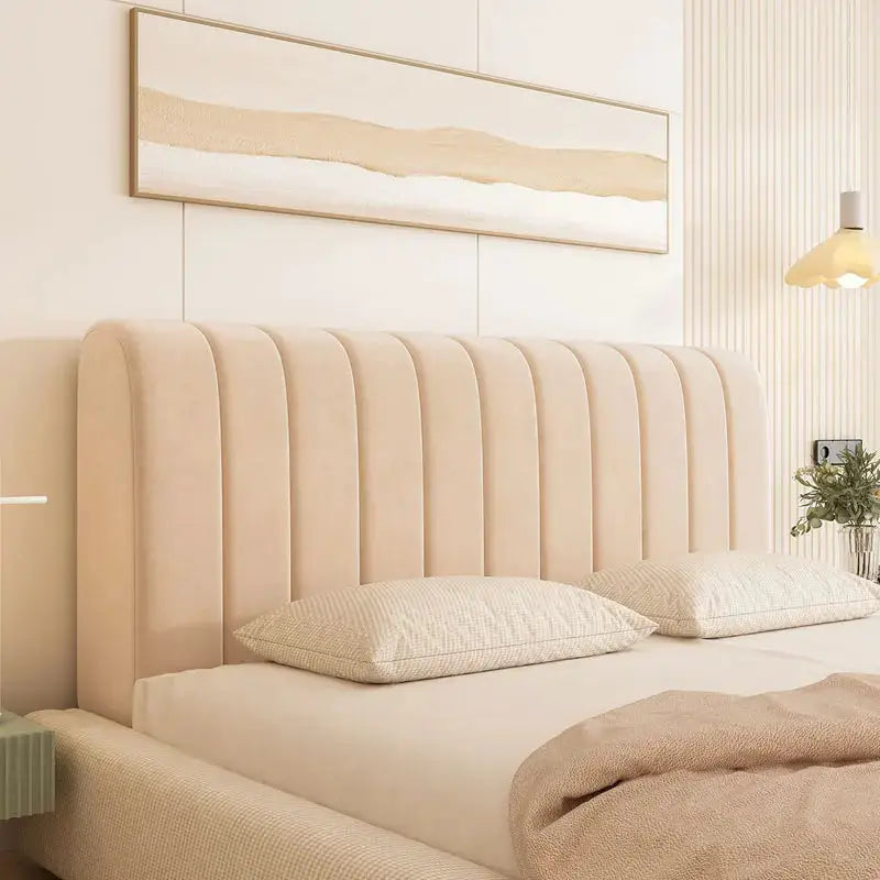 Beige velvet headboard cover with vertical channel tufting for a luxe bed