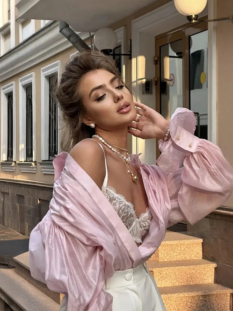 Pink loose collared blouse with satin finish and dramatic puff sleeves for women