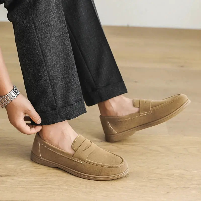Men's tan slip-on loafers with suede-like upper and rubber sole