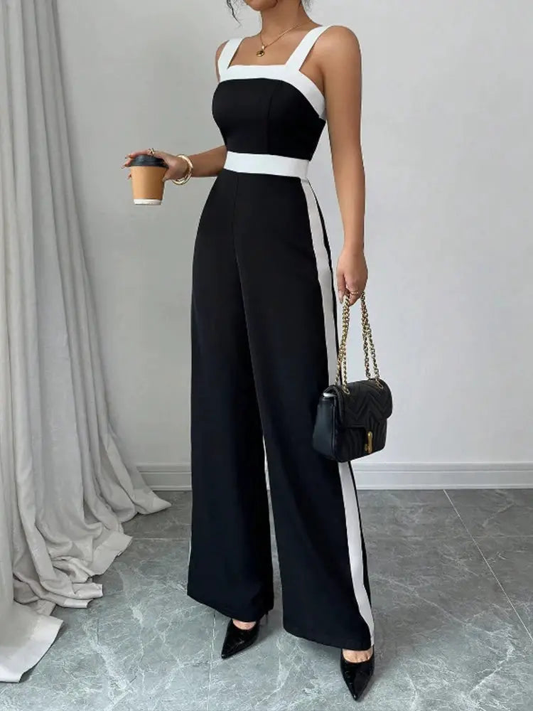 Women's black and white jumpsuit by Simples Market with square neckline and contrast trim, wide-leg pants