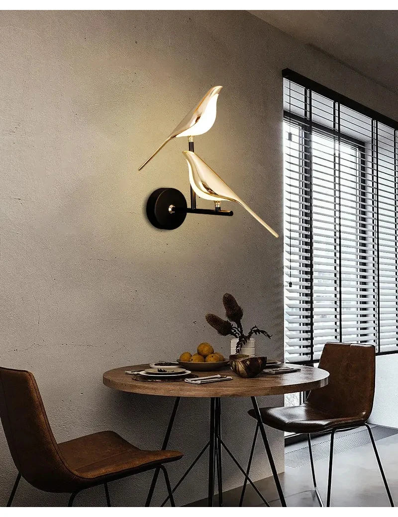Modern LED wall lamp with two cream magpie bird silhouettes on a black wall mount.
