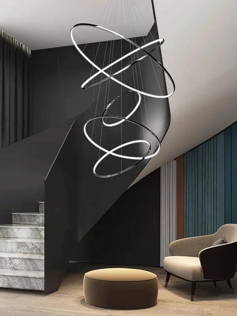 Ring-shaped LED pendant light with suspended spiraling rings for living room decor
