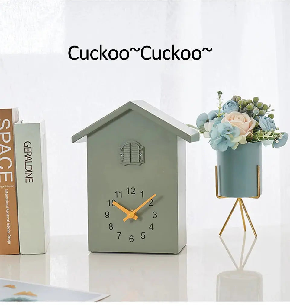 20x25cm green cuckoo quartz wall clock, house-shaped with orange hands and bold numerals