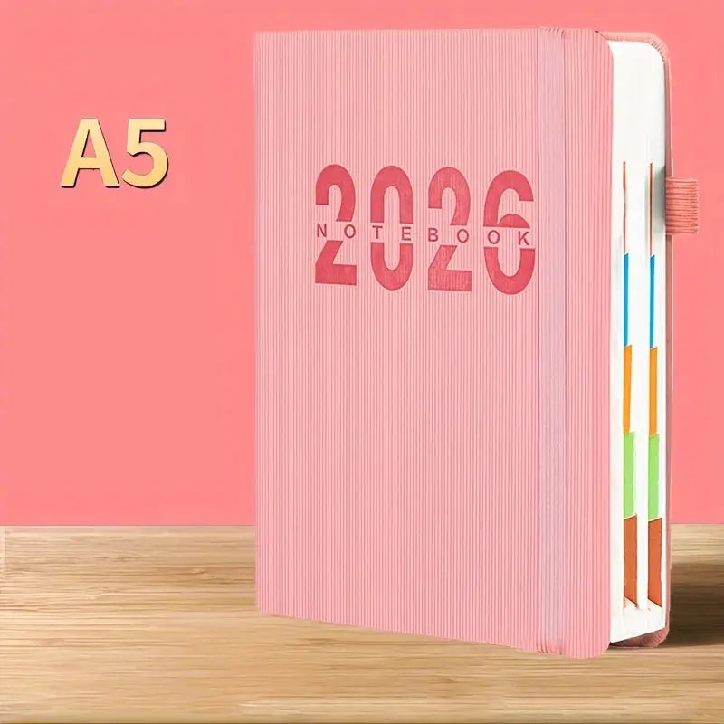 Pink A5 calendar notebook for 2026 with daily plan pages and color-coded tabs