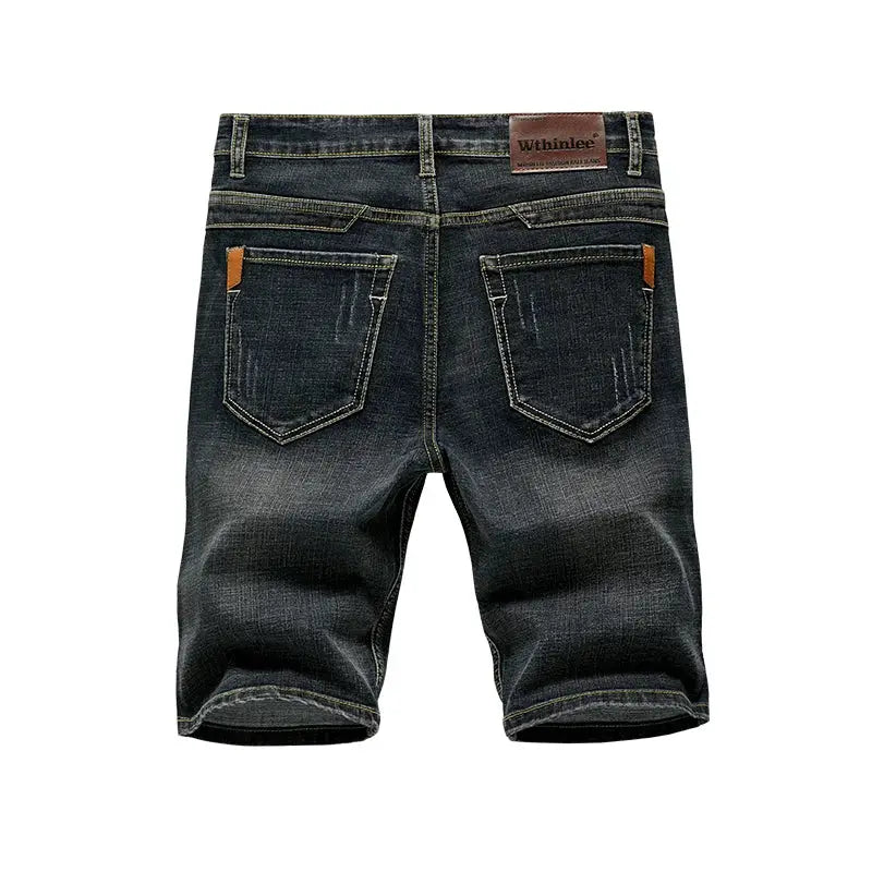 Simples Market men's denim shorts, dark wash slim fit with back pockets and brown leather patch.
