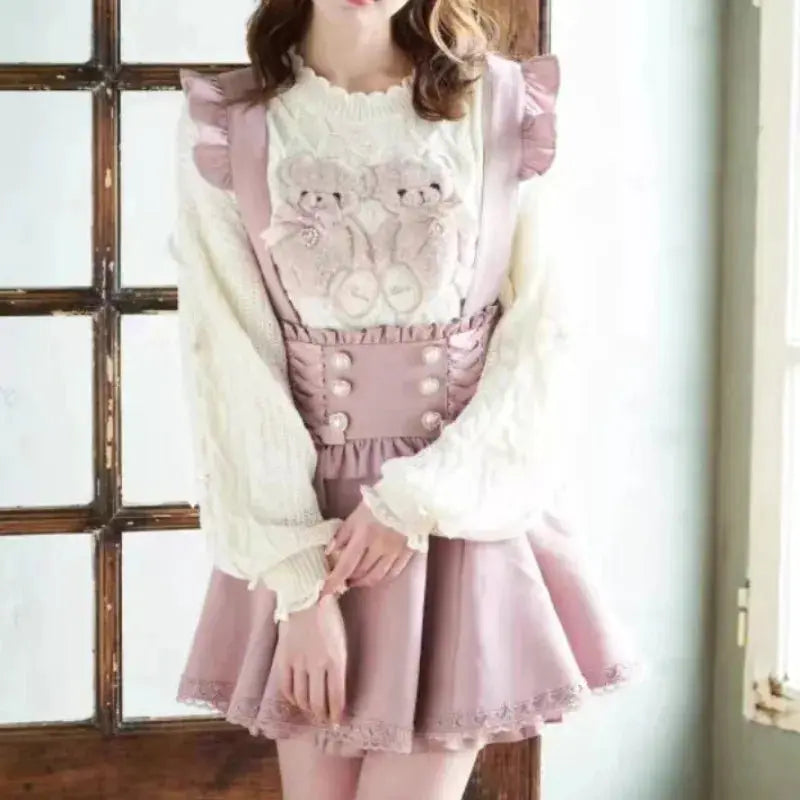 Pink Gothic Lolita short suspender skirt with lace trim and decorative front buttons