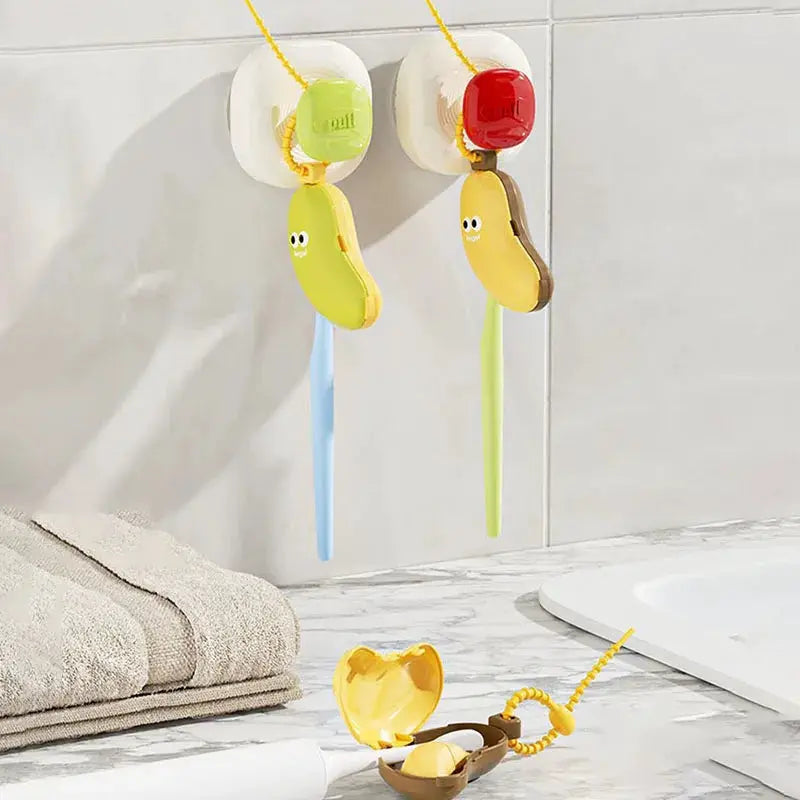 Banana-shaped toothbrush protective caps with toothpaste storage; two playful banana-themed covers in yellow and green.