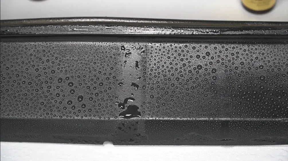Car plastic trim restorer ceramic coating by Simples Market on black rubber trim with water beading
