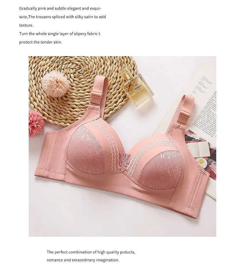 Pink lace bra, underwire-free, with adjustable straps and center bow detail; breathable and comfortable.