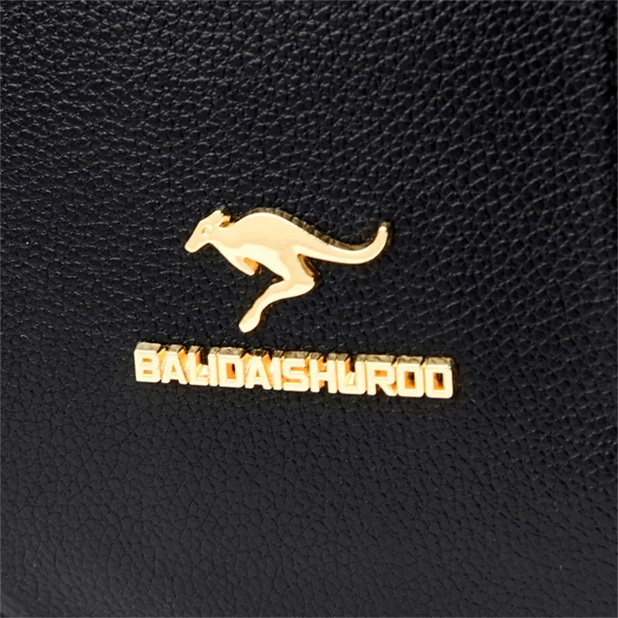 Leather backpack in black with a gold kangaroo emblem and BALDAISHUR00 logo