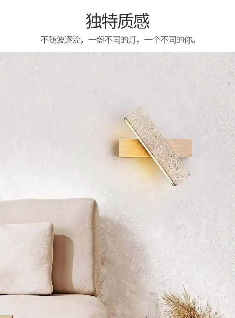 Natural stone wall lamp sconce with wood base by Simples Market, warm ambient light