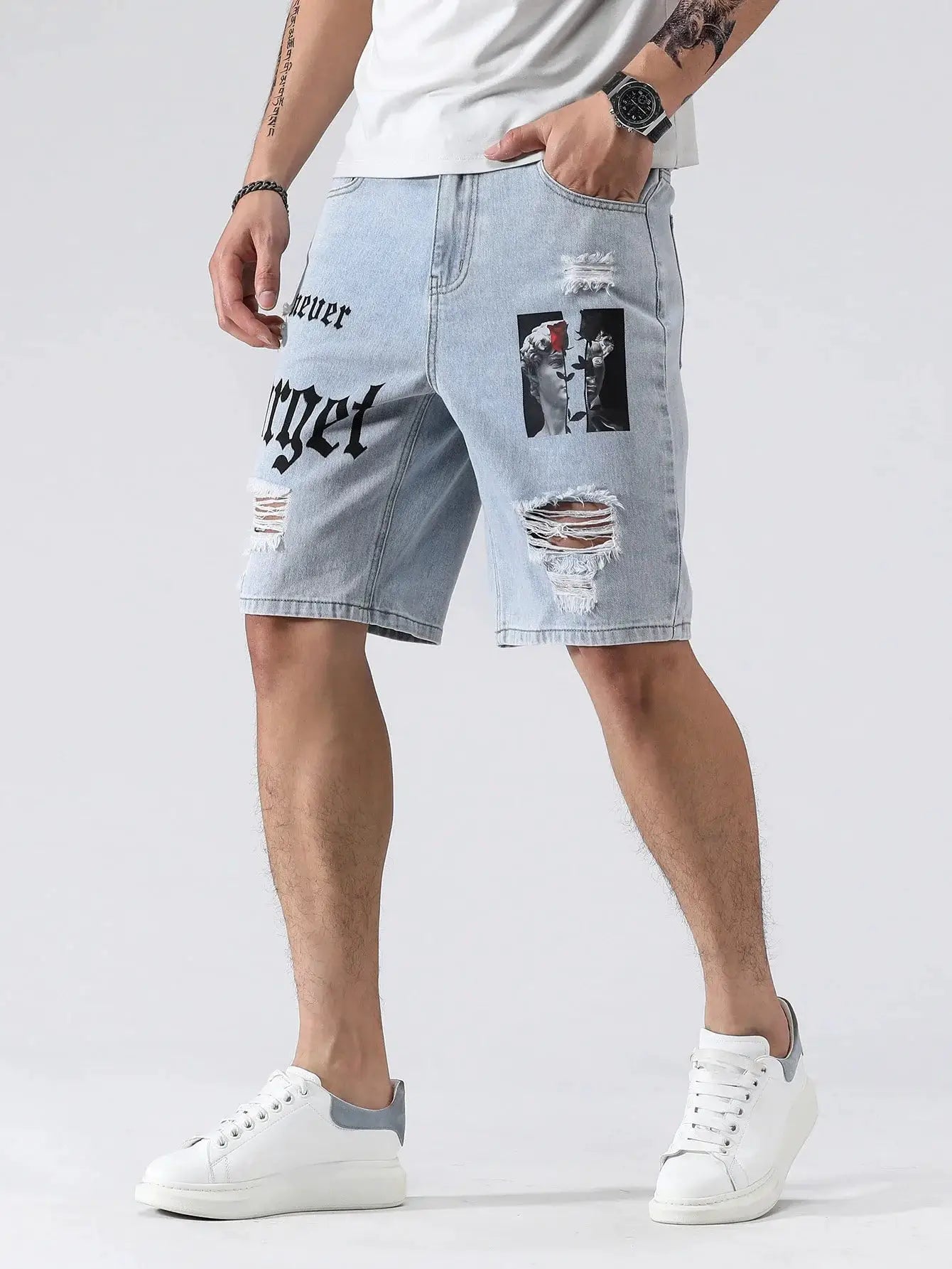Men's light blue denim shorts with ripped knees, patch graphic, knee-length baggy cargo style for casual wear