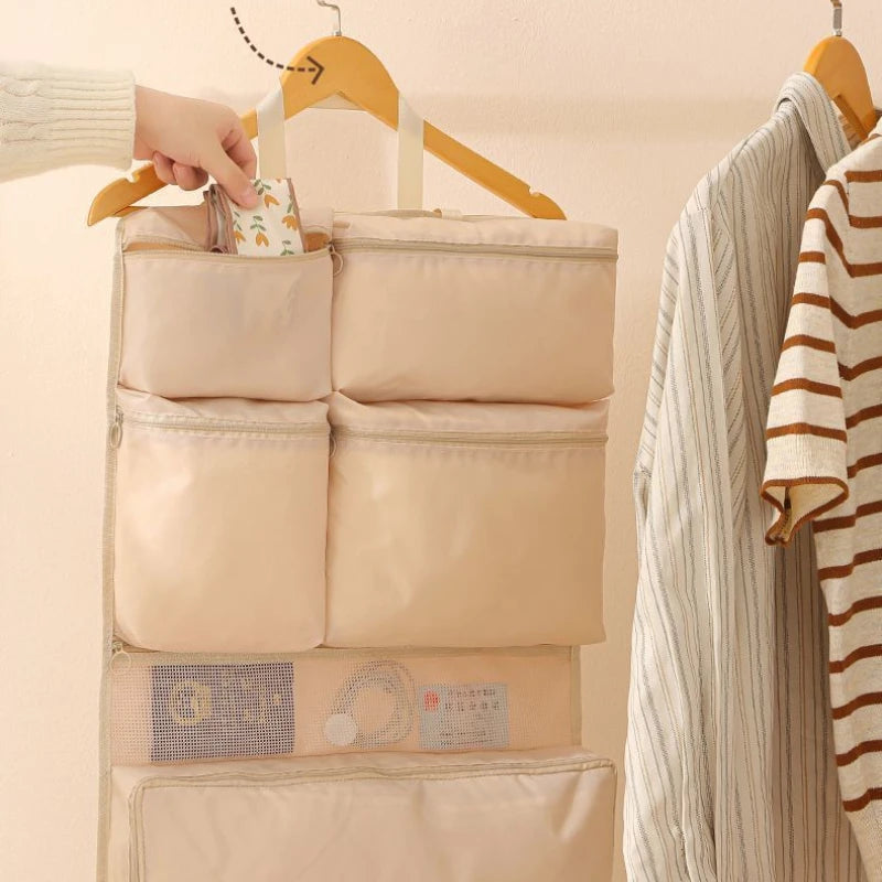 Business Travel Storage Hanging Bag by Simples Market, beige foldable hanging organizer with multiple zip pockets.