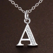 Letter A pendant necklace in sterling silver with zircon stones.