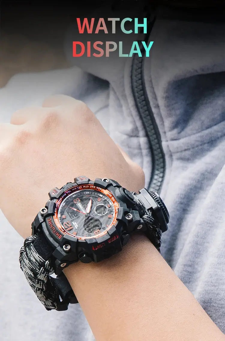 Men's rugged military-style digital watch with orange bezel and paracord strap on wrist