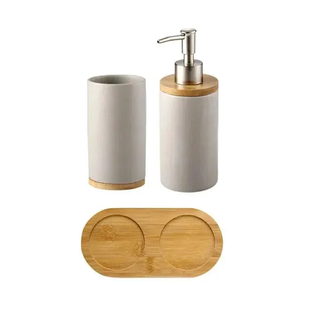Ceramic bathroom accessories set by Simples Market with soap dispenser, toothbrush holder, tumbler and bamboo tray