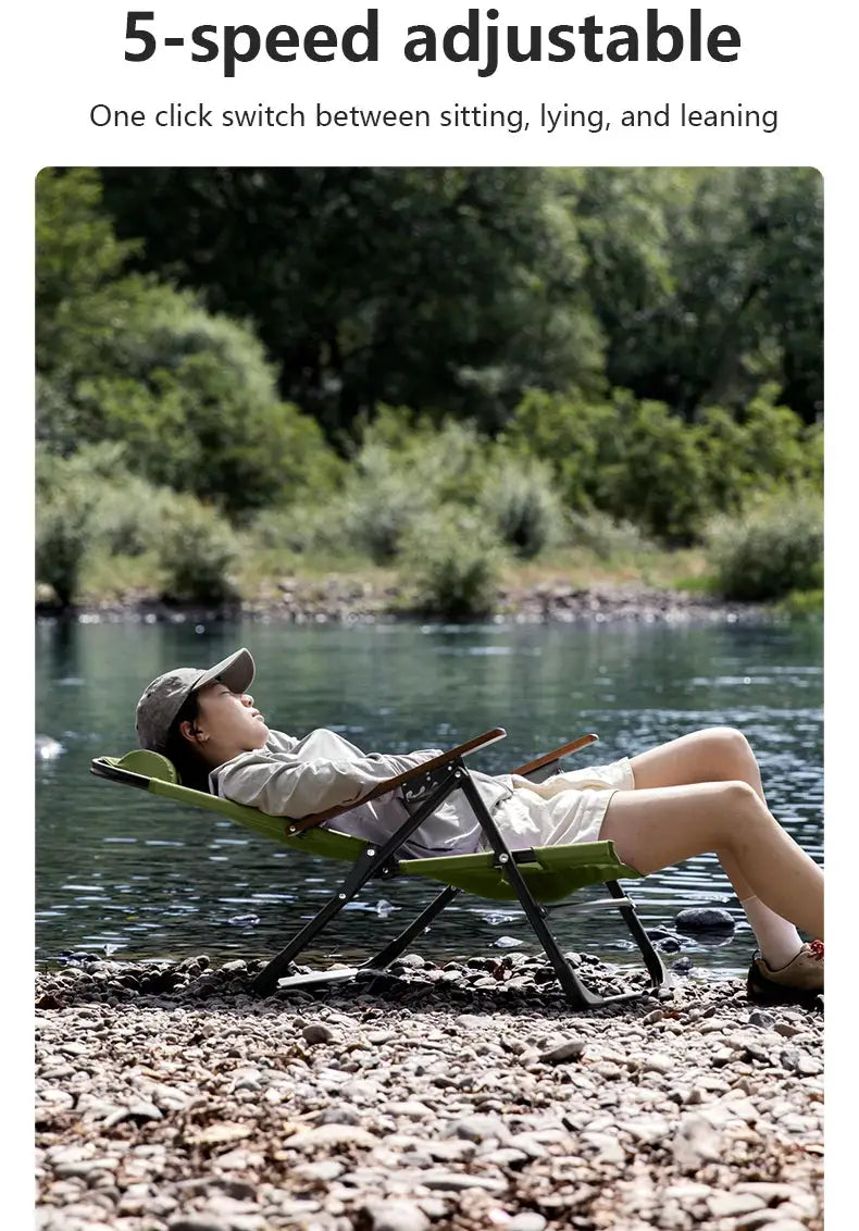 BISINNA camping folding chair in green with adjustable armrests and detachable pillow, shown on a rocky riverside.