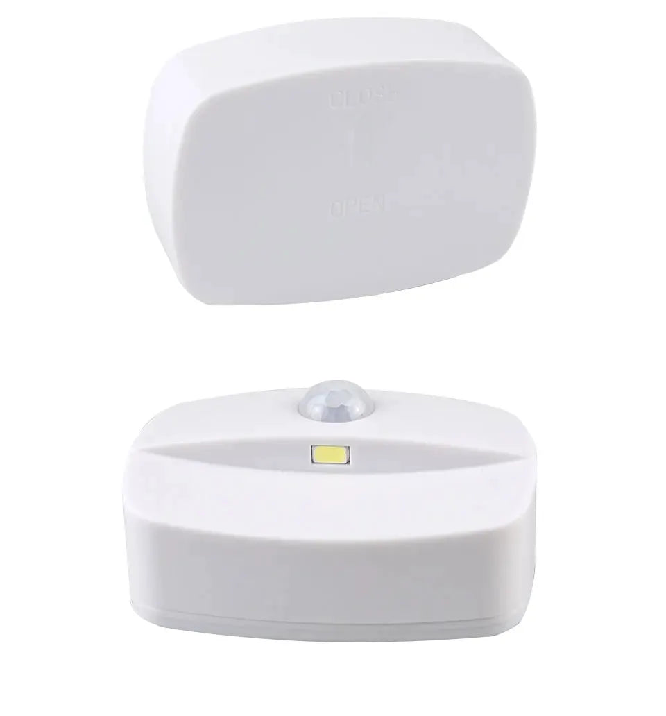 White wireless LED motion sensor night light; battery-powered bedside/staircase lamp