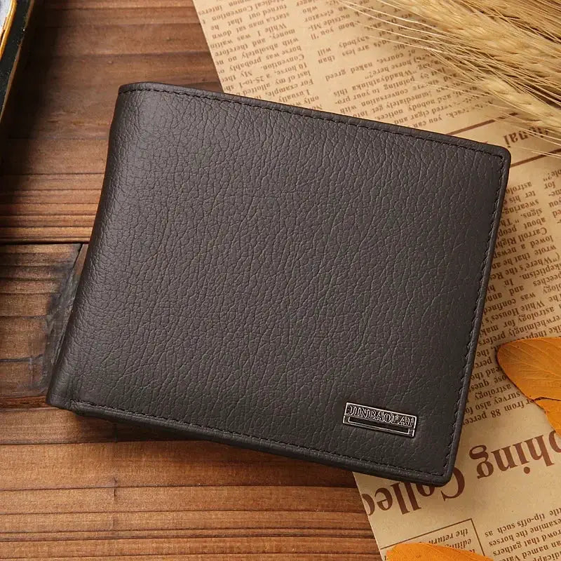Men's black leather wallet with textured grain and stitched edges