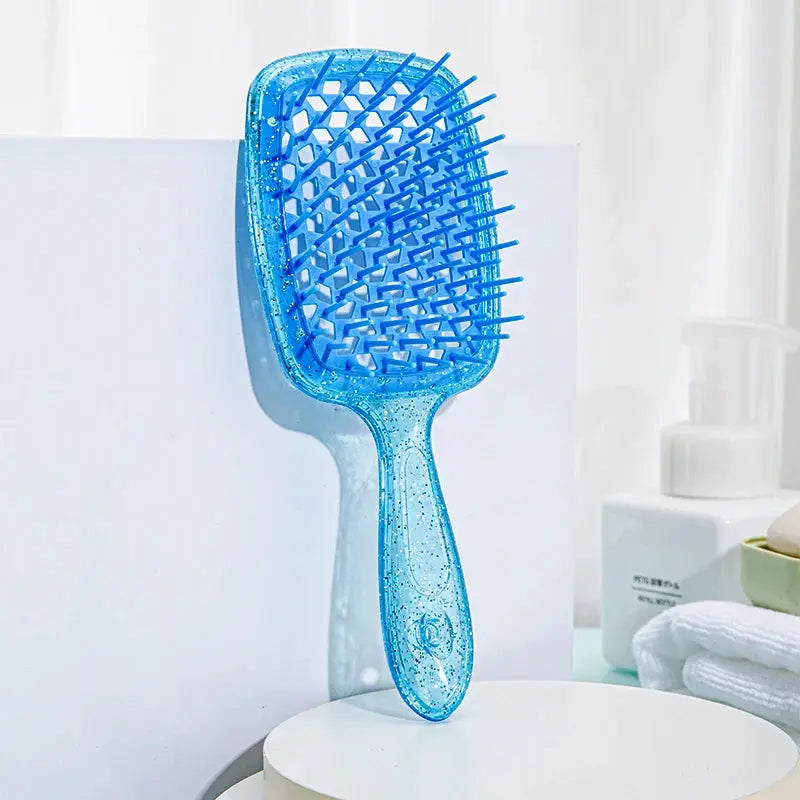 Detangling hair brush by Simples Market, blue transparent paddle with hollow-out design