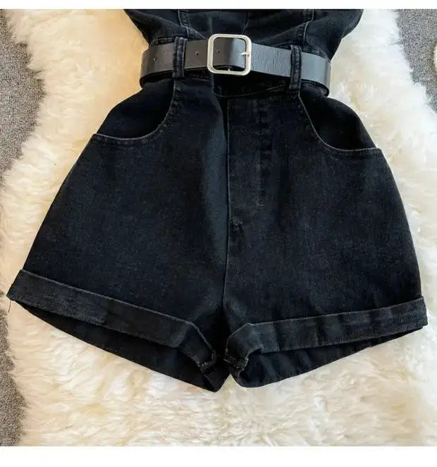 Black denim romper shorts with belt, high-waisted, front pockets, rolled cuffs