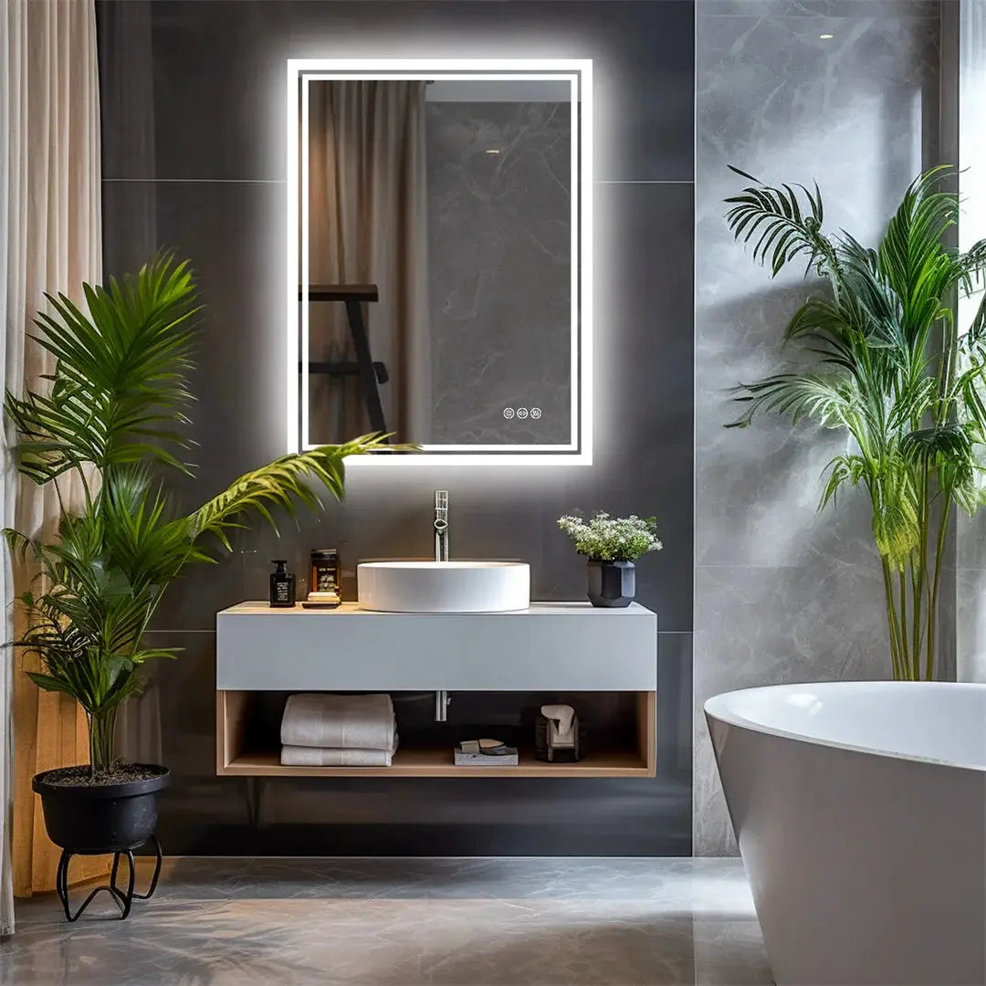 LED backlit frameless bathroom mirror with dimmable defog, above a modern vanity.
