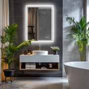 LED backlit frameless bathroom mirror with dimmable defog, above a modern vanity.
