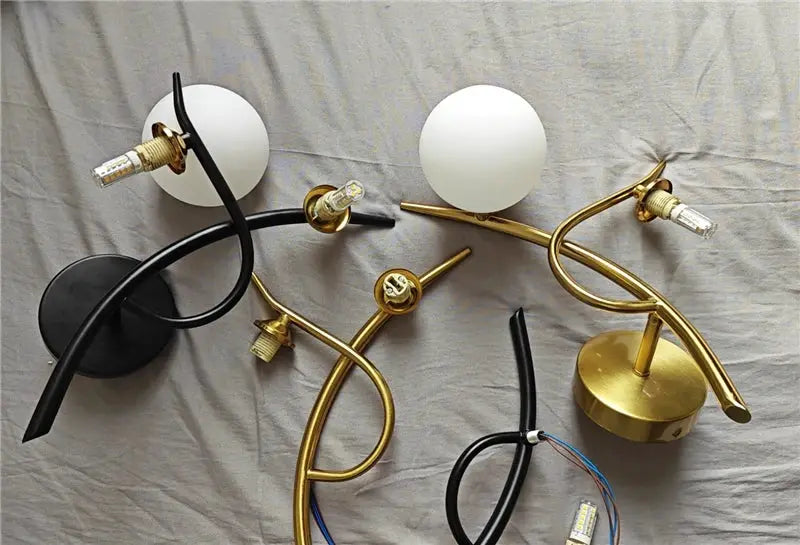 Nordic iron wall lamp set by Simples Market with black and gold finishes and glass globe shades
