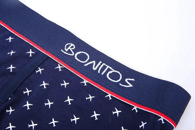 Boxer shorts navy blue with white cross pattern and red waistband; BONITOS logo on waistband.